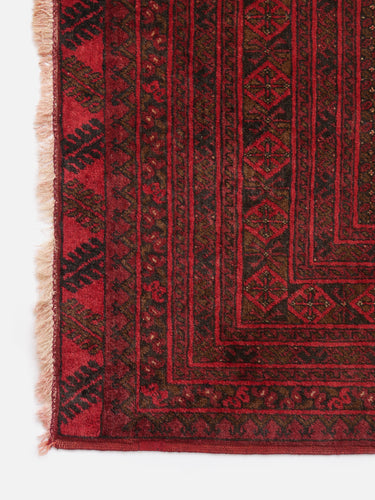 Vintage wool rug · Turkmen · Crimson red & charcoal